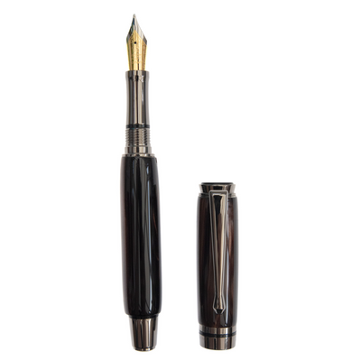 Obsidian Glass handcrafted resin fountain pen made by Wig and Pens. hints of brown, depths of black, flickers of white and an ever-present hint of gold throughout the body of the pen with gunmetal coloured pen clip, tip and hardware. Also available as a ball point pen. Image of pen with lid off.